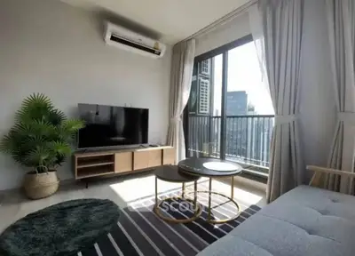 Modern living room with balcony view in high-rise apartment