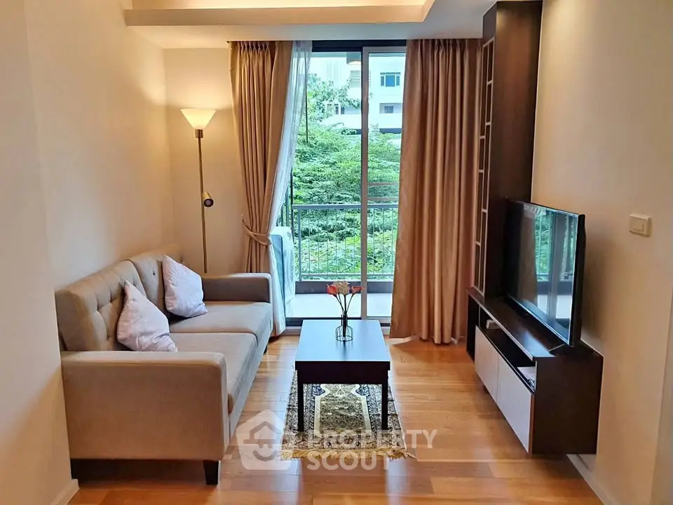 Cozy living room with modern decor and large window view