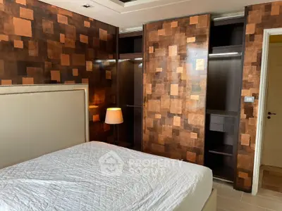 Luxurious bedroom with stylish wooden wall design and spacious closet