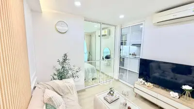 Modern living room with cozy decor and mirrored closet doors
