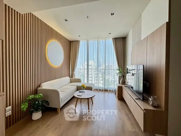 Modern living room with elegant wood paneling and large window offering city views.