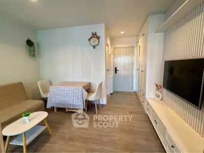 Charming living room with modern decor and cozy dining area, perfect for relaxation and entertainment.