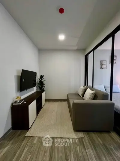Modern living room with sleek design and cozy sofa in stylish apartment.