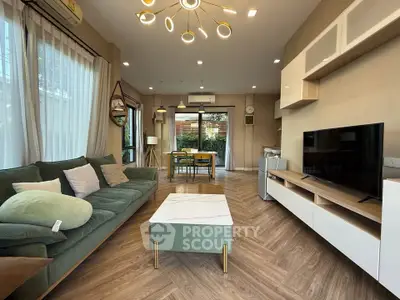 Stylish living room with modern decor and large windows for natural light