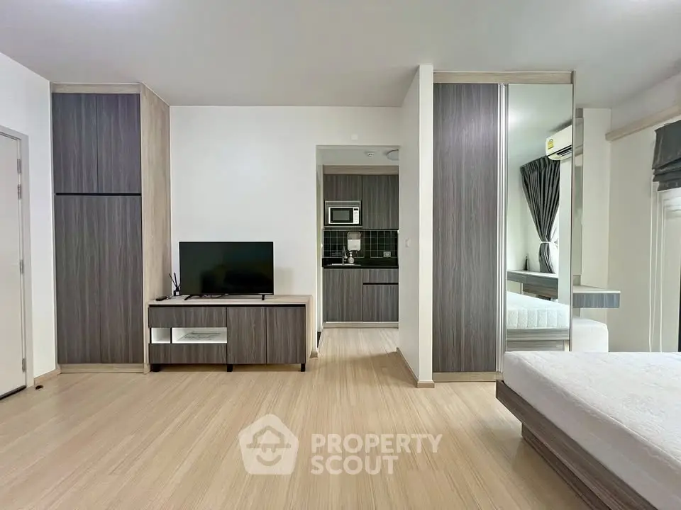 Modern studio apartment with open layout and sleek furnishings