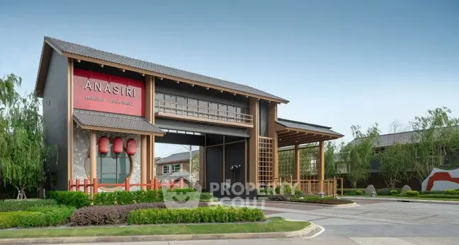 Modern residential building with unique architectural design and lush landscaping.