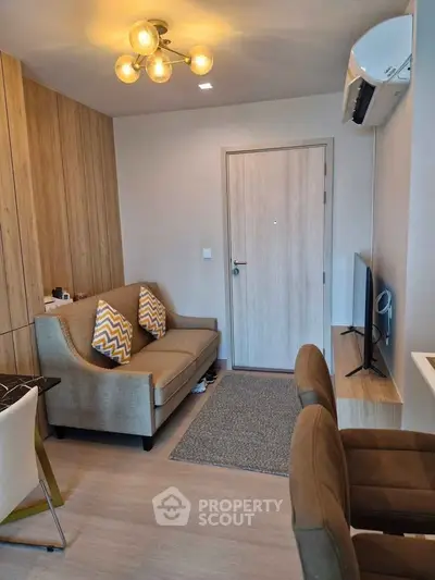 Modern living room with stylish lighting and cozy seating area