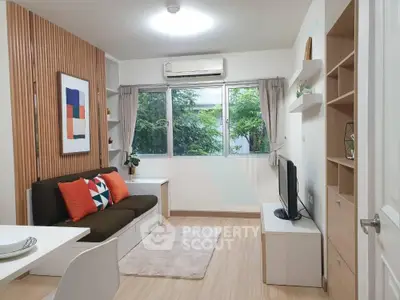 Modern living room with stylish decor and large window view