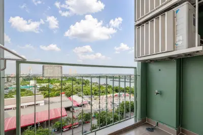Stunning balcony view with lush greenery and cityscape, perfect for relaxation and enjoying the skyline.