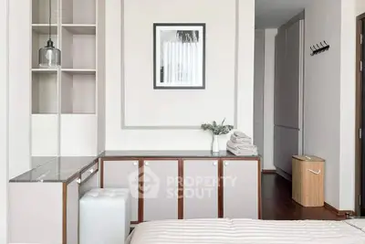Modern bedroom with stylish decor and ample storage space, featuring a cozy atmosphere and elegant design.