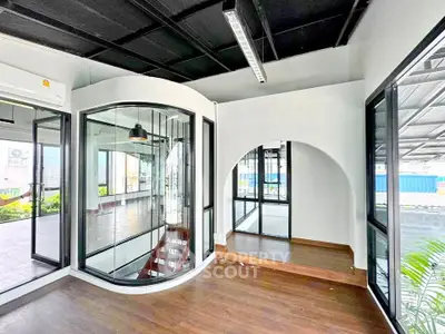 Modern interior space with large windows and unique architectural design