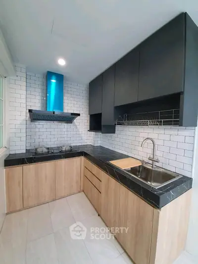 Modern kitchen with sleek cabinetry and stylish backsplash