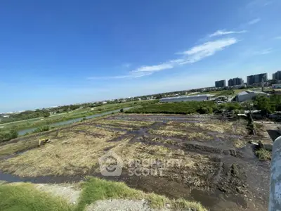 Expansive land plot with potential for development, offering scenic views and proximity to urban amenities.