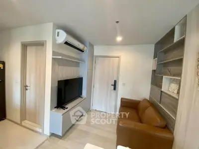 Modern living room with sleek design, featuring a leather sofa, wall-mounted TV, and stylish shelving.