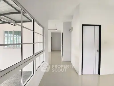 Bright hallway with large windows and modern design