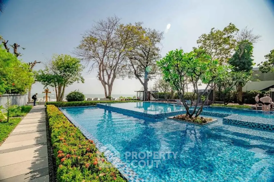 Luxurious poolside view with lush greenery and serene ambiance