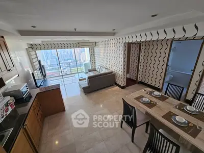Spacious open-plan living room with city view, modern kitchen, and elegant dining area in high-rise apartment.