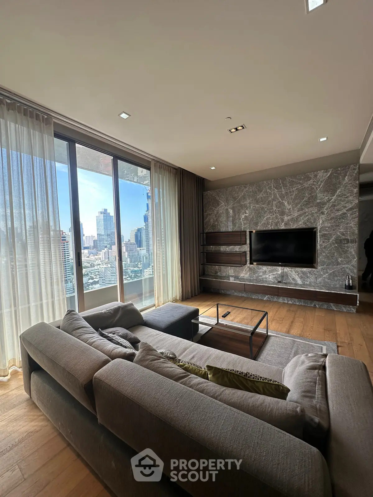 Luxurious living room with panoramic city view and modern decor