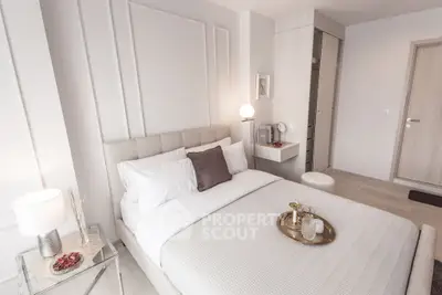 Elegant modern bedroom with neutral tones and stylish decor