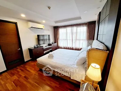 Luxurious bedroom with elegant decor and natural light