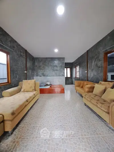 Spacious living room with modern decor and stylish furniture