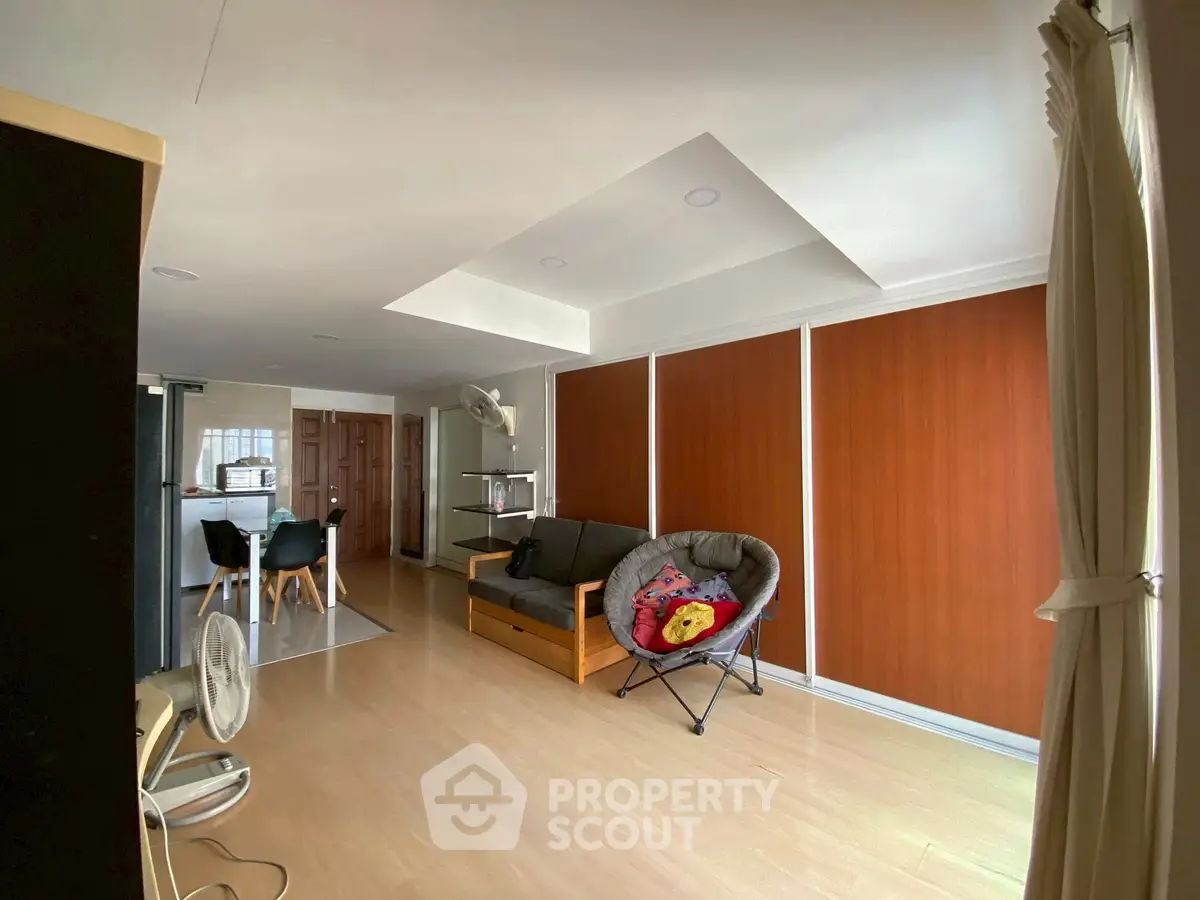 Spacious living room with modern decor and natural light