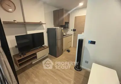 Modern compact living room with kitchen and stylish decor