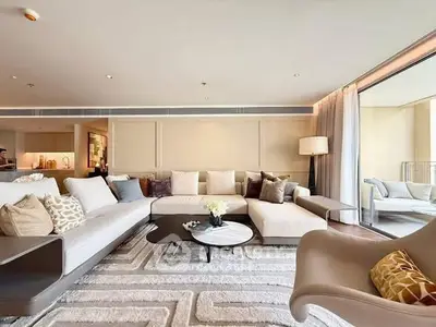 Luxurious modern living room with stylish decor and spacious seating area.