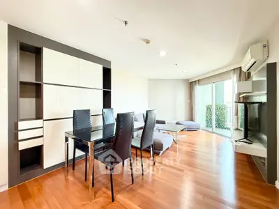 Spacious modern living room with sleek furniture and large windows for natural light.