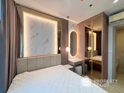 Luxurious modern bedroom with elegant lighting and mirrored wardrobe