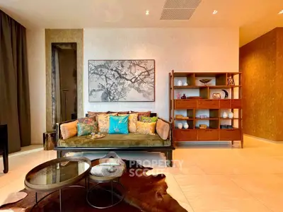 Luxurious living room with elegant decor, plush sofa, and stylish shelving unit, perfect for modern living.
