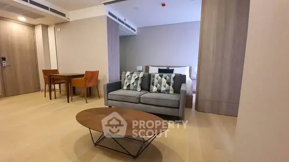 Spacious modern living room with stylish furniture and wooden flooring