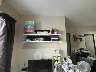 Cozy study room with shelves and desk, ideal for productivity and organization.