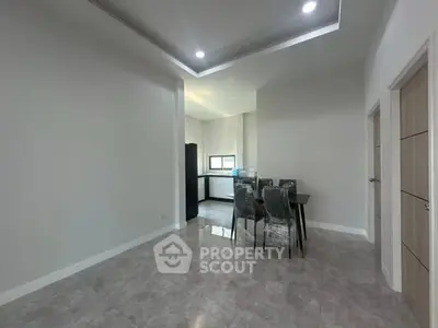 Spacious modern dining area with sleek furniture and natural light