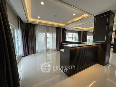 Luxurious modern living room with elegant lighting and large windows