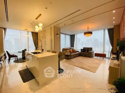 Luxurious open-layout living room with modern kitchen and stunning city view.