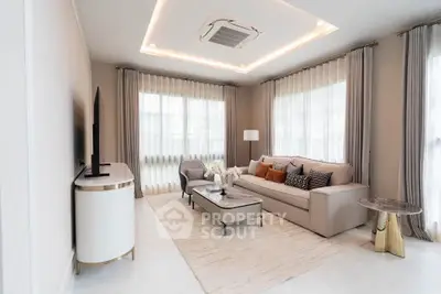 Elegant living room with modern decor and ample natural light