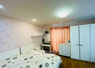 Charming bedroom with floral wallpaper and modern white furniture