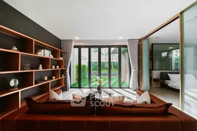 Luxurious living room with modern decor and garden view