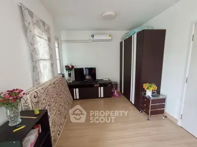 Cozy living room with modern furniture and air conditioning in a stylish apartment.