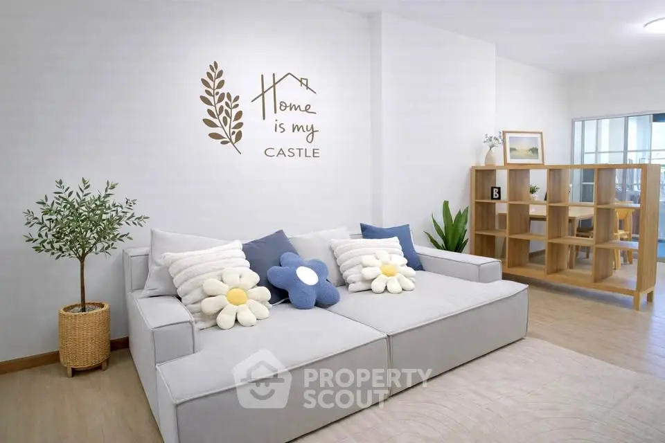 Modern living room with cozy sofa and stylish decor, perfect for relaxation and comfort.