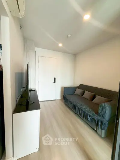 Cozy living room with modern decor and sleek flooring