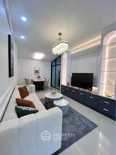 Luxurious living room with elegant chandelier and modern decor