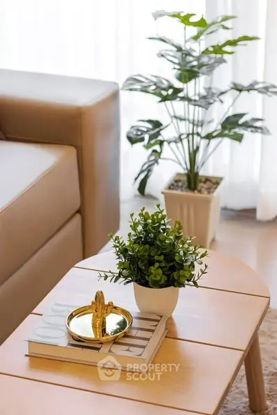 Stylish living room with modern decor and indoor plants.