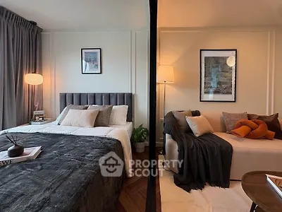 Stylish bedroom with cozy seating area and modern decor