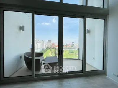 Spacious balcony with stunning city and golf course view, perfect for relaxation and entertainment.