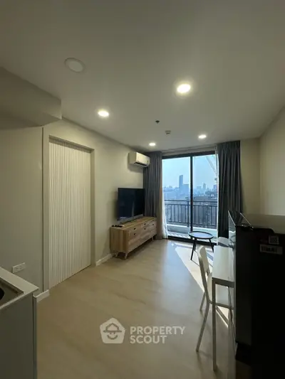 Modern living room with city view and balcony access