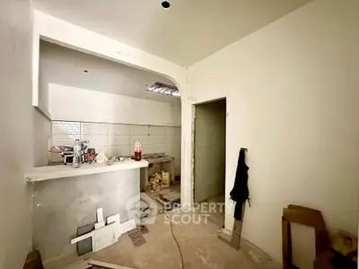 Under-construction kitchen with open layout and modern design potential.