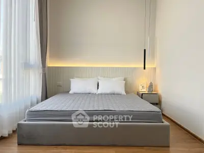 Modern bedroom with minimalist design and cozy lighting