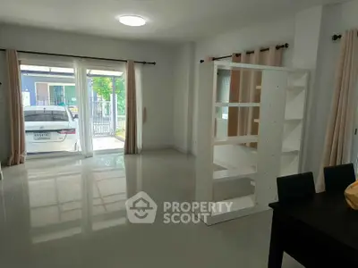 Spacious living room with large windows and modern decor